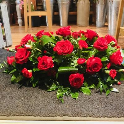 Red rose casket spray